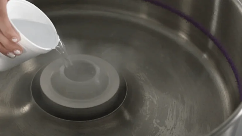 use hot water to clean your cotton candy machine