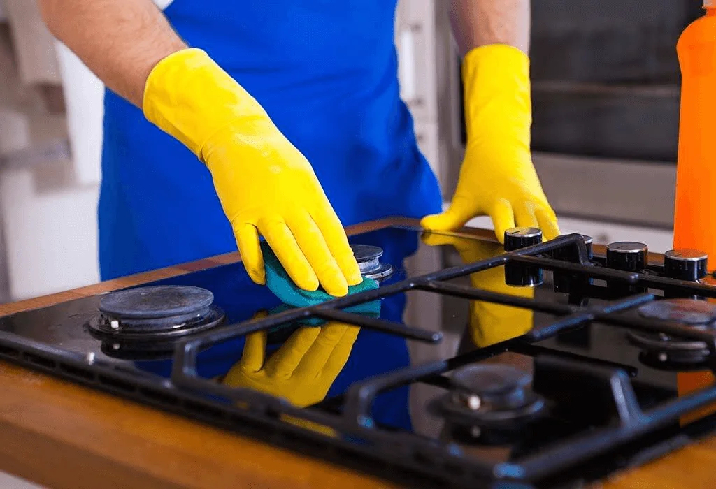 clean the stovetop and burners