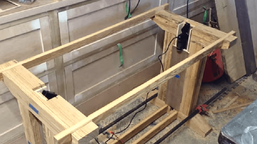 Open the clamps from the wood and place the actuators in them