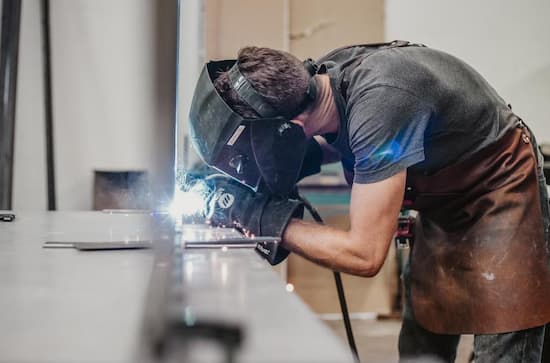 man bending over cutting