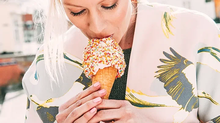 a woman eating ice cream