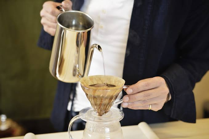 Pouring tea made with the distilled water