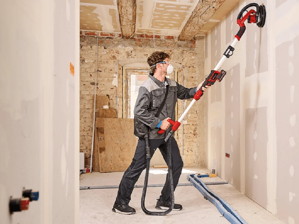 Sanding drywall with power sander