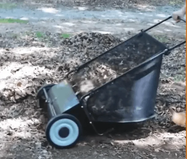 VEVOR Lawn Sweeper in use