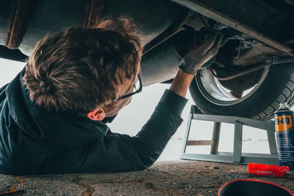 man under car