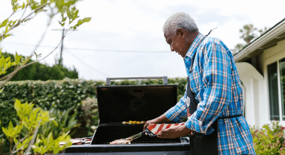 A man cooking on a grill